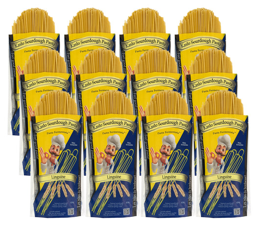 Twelve packages of Kaslo Sourdough linguine Pasta on a white background
