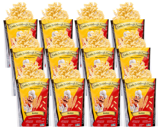 Twelve  packages of Kaslo Sourdough Rotini Pasta on a white background