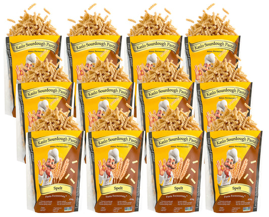 Twelve packages of Kaslo Sourdough Spelt Pasta with a yellow and brown design.
