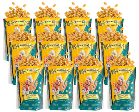 Twelve packages of Whole Wheat Kaslo Sourdough Pasta on a white background