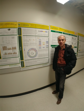 Dr. Michael Gaenzle in front of the poster related to Vi's research.